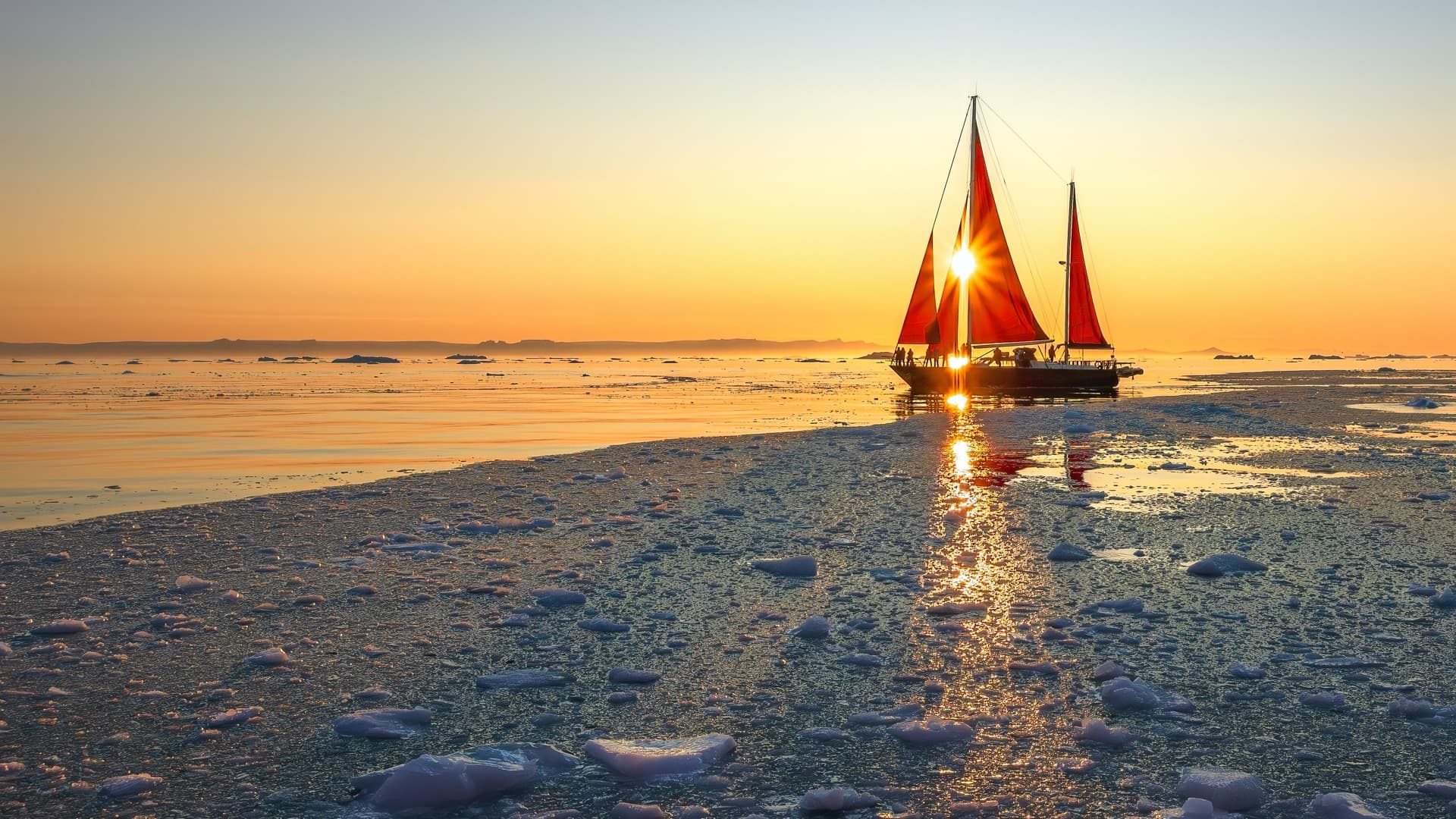 Sailing through Greenland's Ilulissat Icefjord at midnight